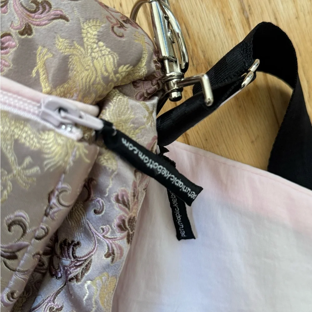 Petunia Pickle Bottom Pink and Gold Baby Bag sushi roll color
